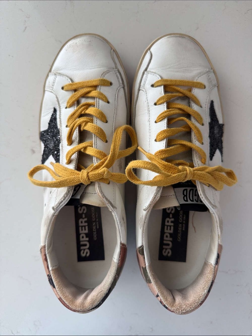 Golden Goose White Sneakers with Mustard Laces and Black Sparkle Star.